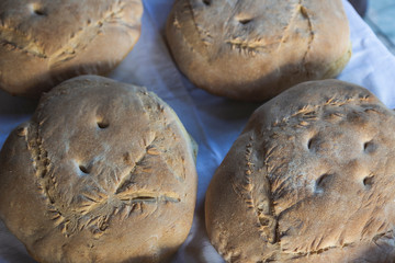 Photograph of how homemade bread is made in a wood-burning oven.