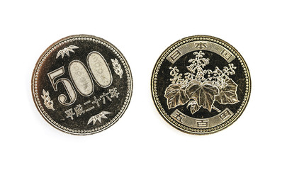 Japanese money, metal coins on white background. 500 yen, JPY currency, macro view. Finance, banking and business in Japan concept.