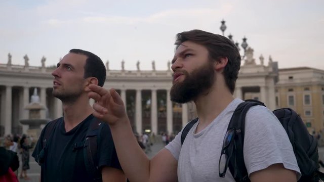 Young Male Tourists Viewing Famous Location in Vatican City, Rome.
