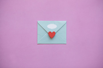 An envelope with a red heart for Valentine's Day or for Women's Day or for the wedding. A joyful...