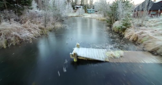 A broken pier that froze with a creek.