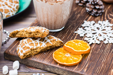Christmas cookies and dried mandarin slices  on a table in Christmas decorations