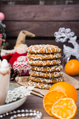 Christmas cookies and dried mandarin slices on the table in Christmas decorations