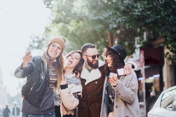 Group of friends on the street walking around having fun