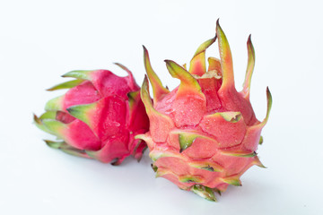 Fresh pitahaya fruit on white background or ripe dragon fruit red color with copy-space design for drinks package design, healthy article picture and plantation guide book design