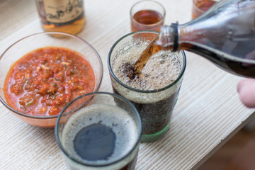 Carbonated drink poured into a glass.