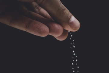 seasoning salt cooking on black background