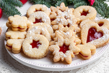 Traditional Linzer Christmas cookies arranged on a plate