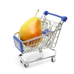 Beautiful ripe pear lies in a shopping cart isolated on a white background. Conceptual image