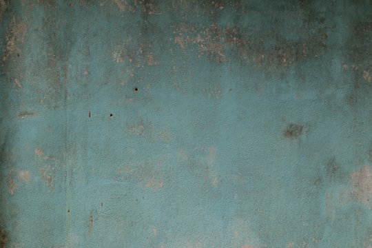 Old cement wall paint blue color abstract background.