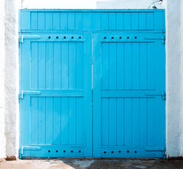 Closed blue door with frame Isolated