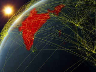 India on model of planet Earth with network and international networks. Concept of digital communication and technology.