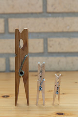 three clothespins of different size