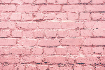 Obraz premium Pink uneven brick wall close-up