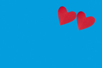 background for Valentine's day holiday, heart on blue background, couple of hearts on red and blue background