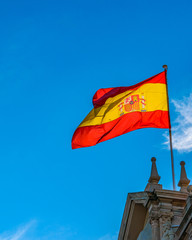 Spain Flag Waving at Top of Building