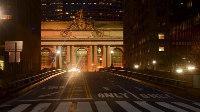 Timelapse of cars in front of Grand Central Terminal at night.