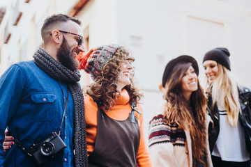 group of friends on the street walking around having fun