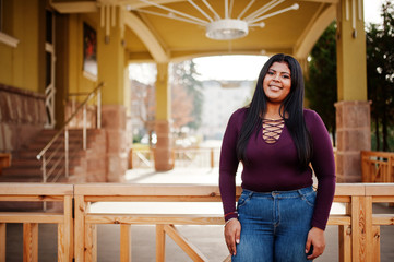 Pretty latino xxl model girl from Ecuador wear on violet blouse posed at street.