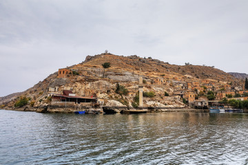 Fototapeta na wymiar Landscape of Halfeti in the foreground Euphrates River and Sunken Mosque. Sanliurfa, Gaziantep in Turkey
