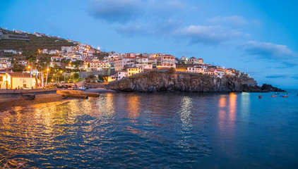 Fototapeta na wymiar Harbor and fishing village Camara de Lobos at twilight time, Madeira island, Portugal
