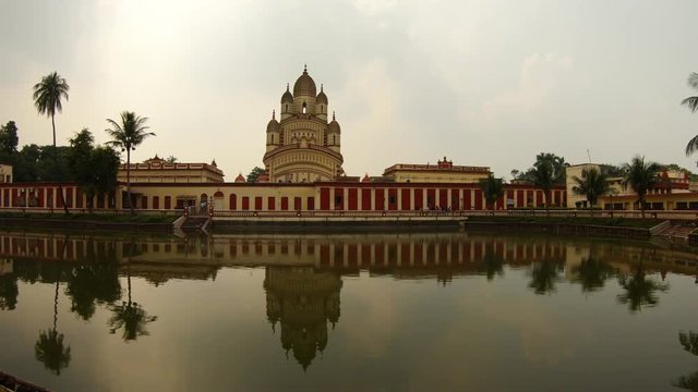 Beautiful big temple with reflection in water of pond with mirror surface Ramakrishna mission Kolkata cloudy day