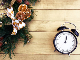 Christmas wreath. The clock is almost twelve at night. The beginning of the new year. Free space...