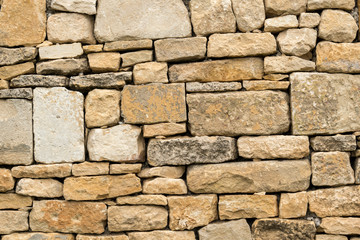 Stone wall background at autumn.