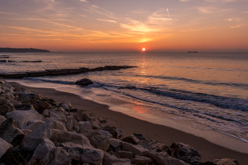 Fototapeta na wymiar Early autumn sea sunrise at the beach.