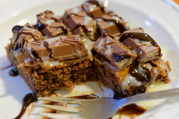 chocolate cakes or commonly known as brownies, decorated with candies, cookies and different sweet sauces