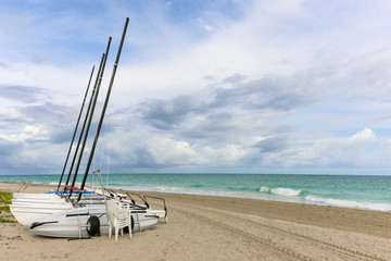 Sailing catamarans without sails on the beach, Cuba, Varadero