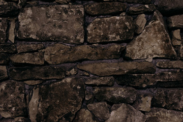 Ancient stone fence shot close.