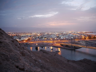 view on the fishermen city of Sur with its lighthouse during the blue hour, Oman, Middle East
