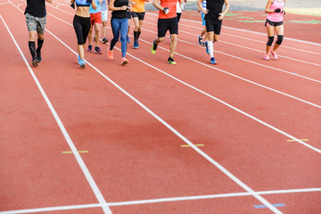 Obraz premium Group at the stadium running outdoors training.