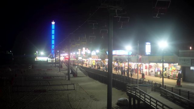 Ocean amusement pier and boardwalk on a foggy night at the Jersey Shore.