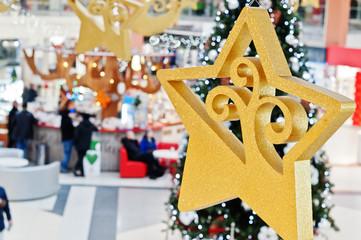 New Year decorations in shopping mall with Christmas tree.