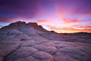 A colorful sunset at White Pocket, Arizona in the Vermilion Cliffs National Monument