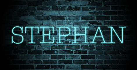 first name Stephan in blue neon on brick wall
