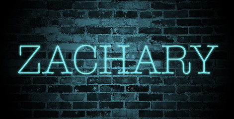 Fototapeta premium first name Zachary in blue neon on brick wall