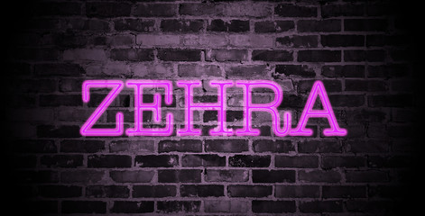 Obraz premium first name Zehra in pink neon on brick wall
