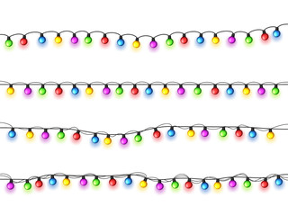 Christmas glowing lights on white background. Garlands with colored bulbs. Xmas holidays. Christmas greeting card design element. New year,winter.