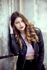 Young woman wearing leather jacket outdoors