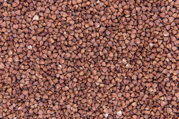 Dark Buckwheat Texture. Background Buckwheat Groats Close-up.