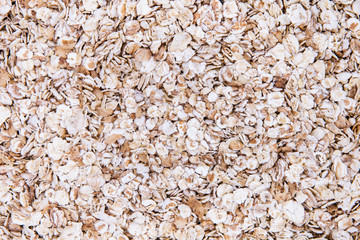 Background Or Texture Of Rolled Oats Close-up.