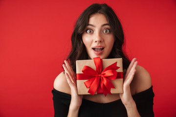 Fototapeta premium Happy young woman wearing a dress standing