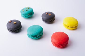 Sweet and colorful macaroons or macarons on white background