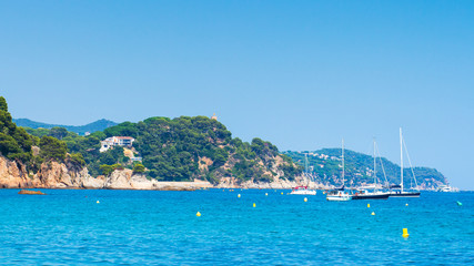 Fototapeta na wymiar Yachts and boats near coastline sea in Ibiza