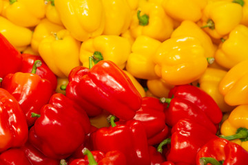 Sweet Red Peppers And Yellow Pepper Close-Up. Red Yellow Background. Paprika Peppers. Healthy Eating, Bazaar, Nutrition Concept.