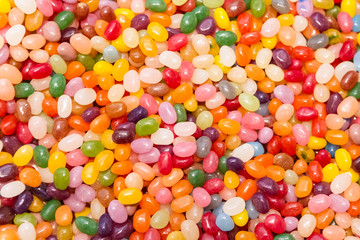 Bright, Festive And Colorful Background Or Texture Of Jelly Beans. Cheerful Mix Of Multiсolored Candies. Children's Holiday Concept. Top View.