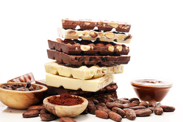 Chocolate bars on table with chocolate tower.